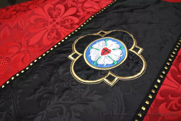Luther Rose Embroidery Design on Black Evesham Liturgical Fabric Chi Rho Symbols