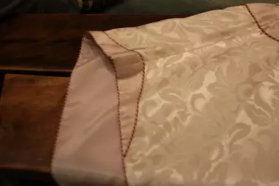Unusual design details on the chasuble feature a turn-back cuff on the edge of the chasuble shoulder seam